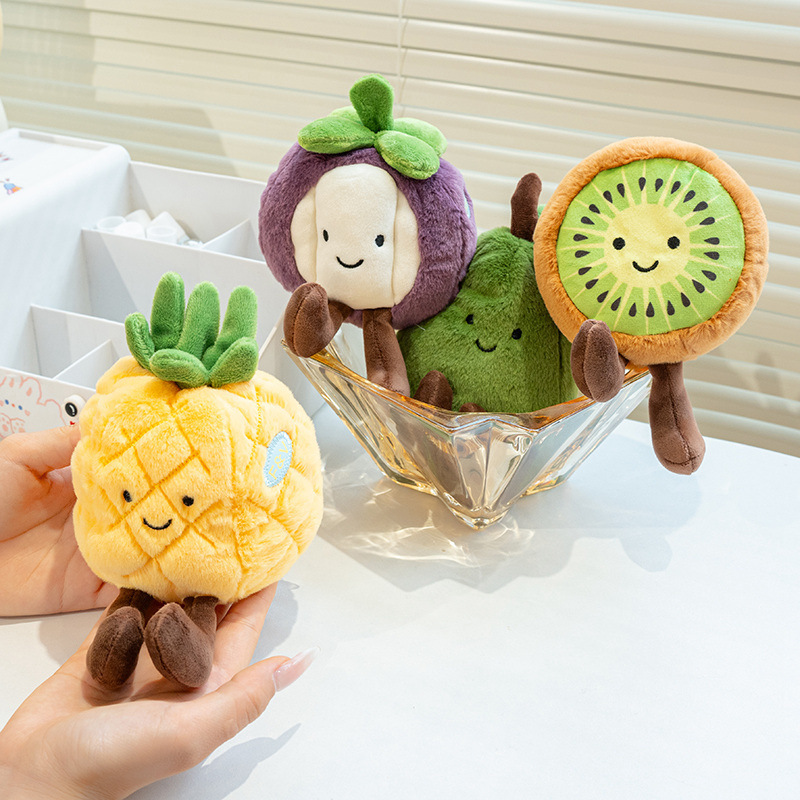 Cute eco fruit plush toys on a table with glass bowl