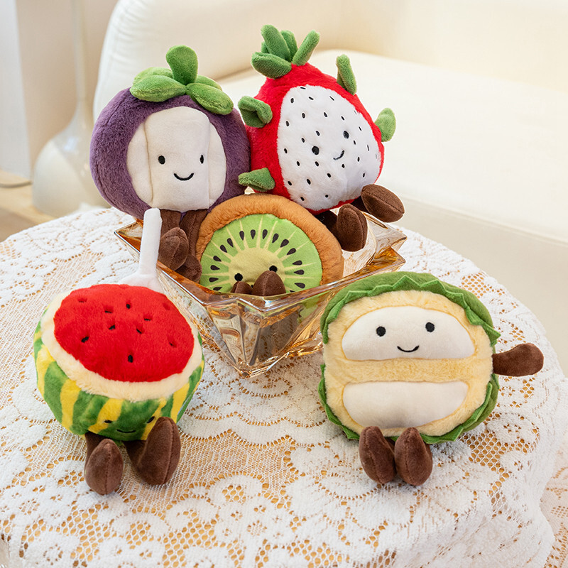 Eco fruit plush toy collection with banana, strawberry, apple, kiwi, and pineapple on a table