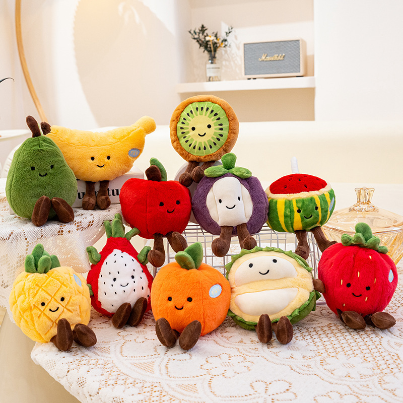 Eco fruit plush toy series with mixed fruit designs on a table