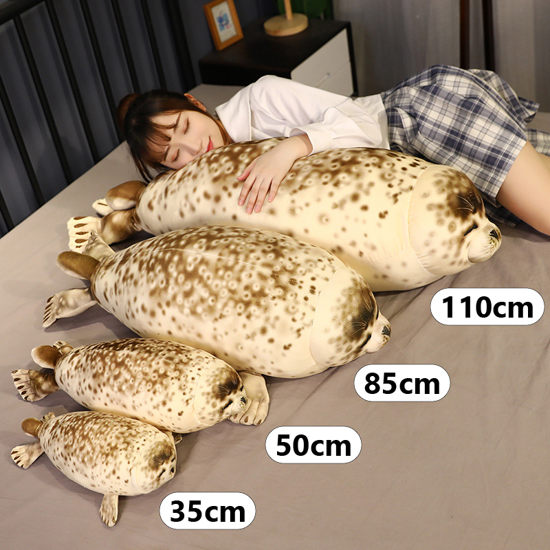 Seal plush pillow size comparison showing 35cm 50cm 85cm and 110cm on bed