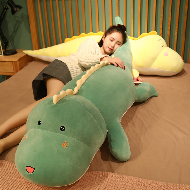 Large dinosaur plush pillow for full-body hugging and relaxing on bed