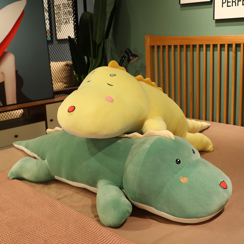 Cute dinosaur plush pillows for relaxing and decorating the bed