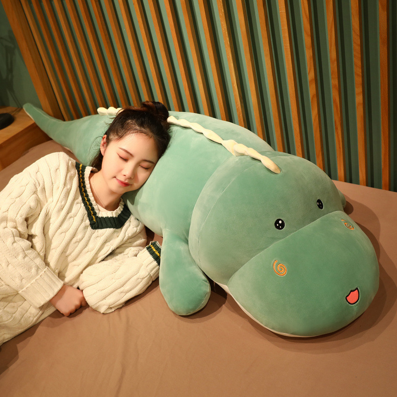 Cute dinosaur plush pillow for side sleeping and relaxing on the bed