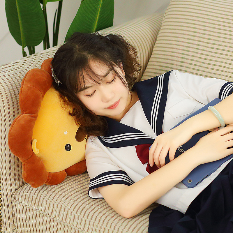 Lion plush pillow used as a soft cushion for resting on a sofa in a cozy living room