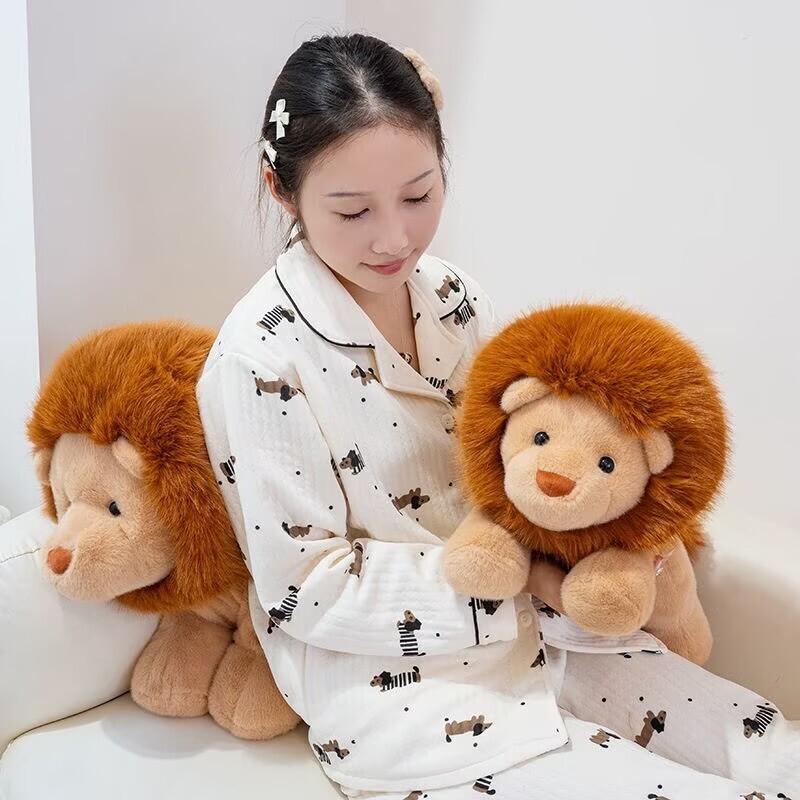 Two lion plush toys displayed on a sofa, showing soft texture and cuddly size for home comfort and decoration