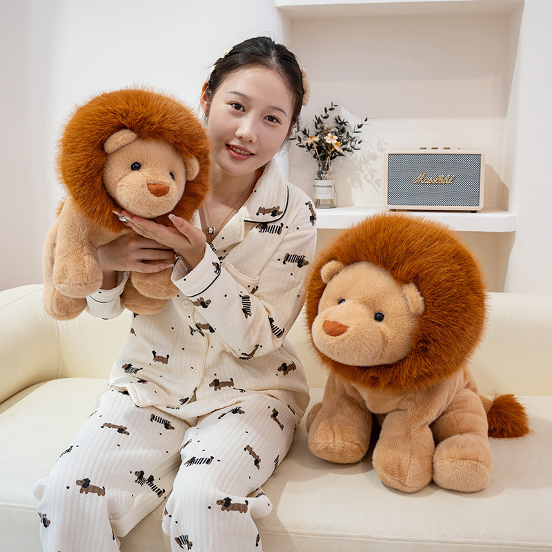 Lion plush toy displayed on a sofa, showing its soft fur, fluffy mane, and sitting posture for home decoration and cozy relaxation