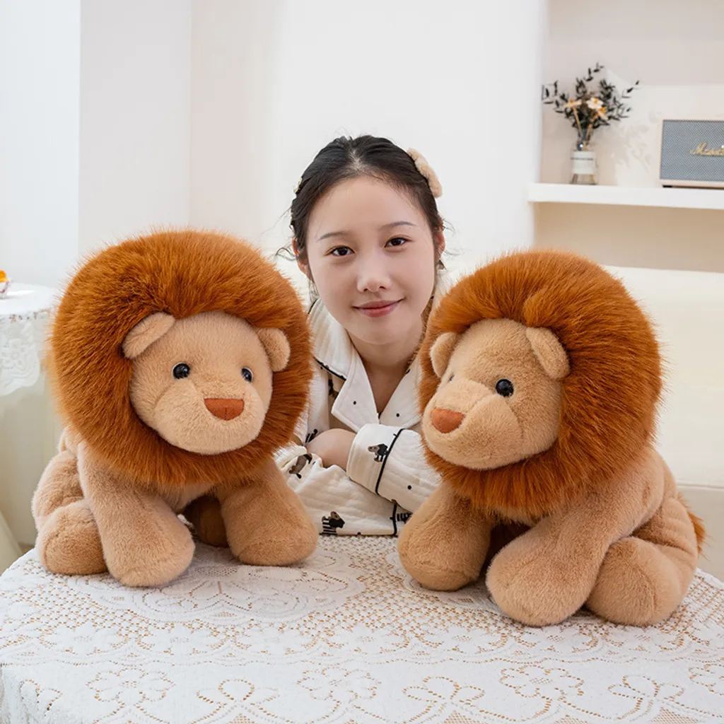 Two lion plush toys sitting on table for home decor