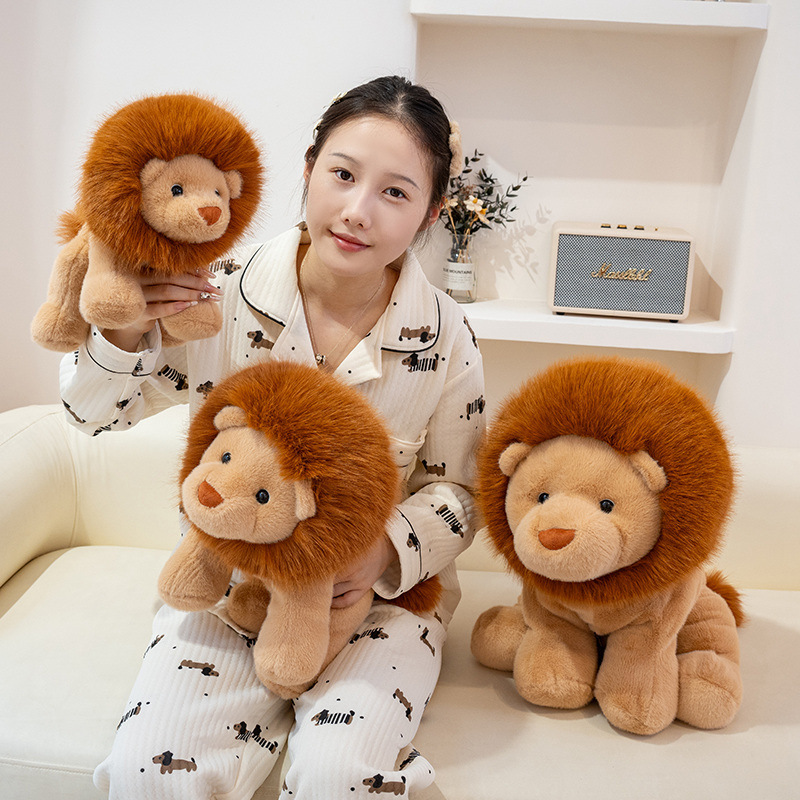 Lion plush toys in three different sizes arranged on a sofa, highlighting the size comparison and their cute, fluffy design for home decor