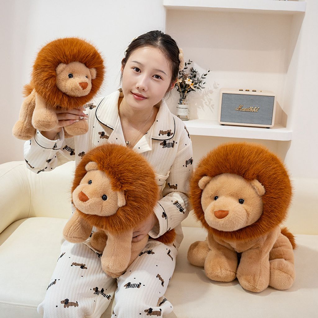 Lion plush toys in three different sizes arranged on a sofa, highlighting the size comparison and their cute, fluffy design for home decor