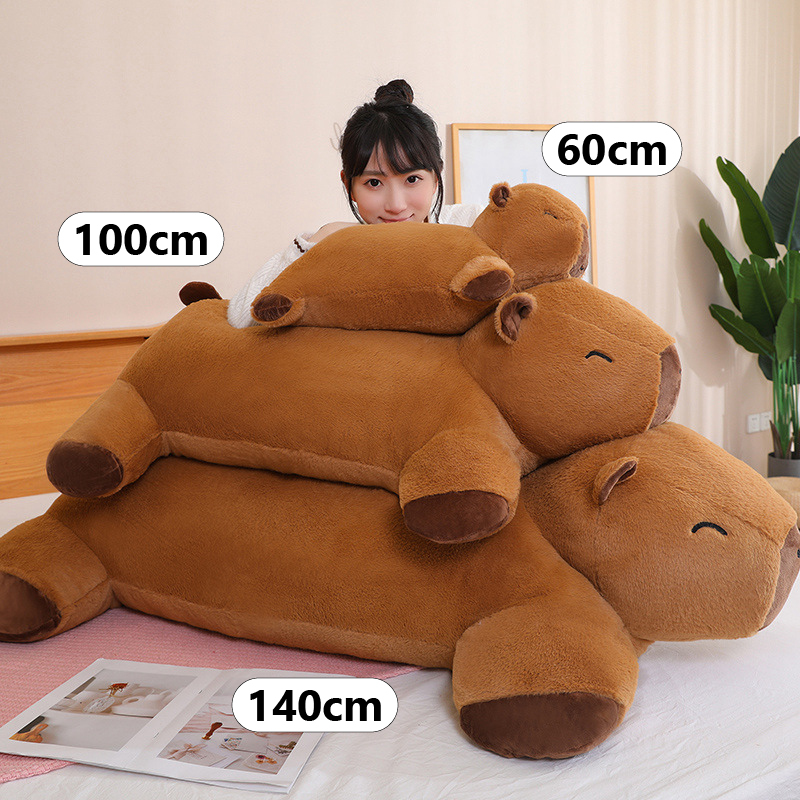 Capybara plush cushion size comparison in 60cm 100cm and 140cm on bed