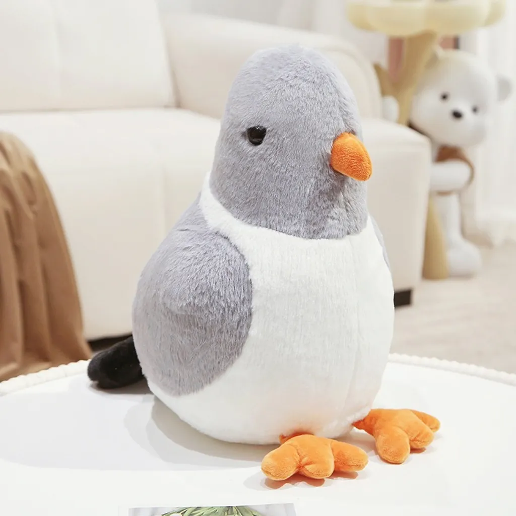 Gray pigeon plush toy with fluffy texture and orange feet on living room sofa