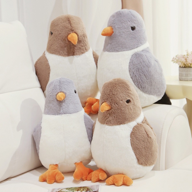 Group of cute pigeon plush toys displayed on sofa for home decor and cozy atmosphere