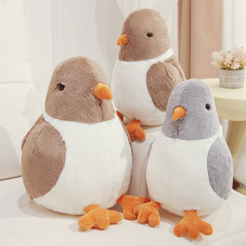 Cute pigeon plush toys in gray and brown colors arranged for decorative and relaxing home setting