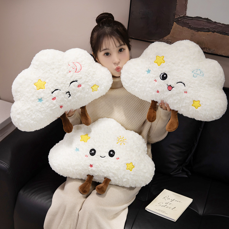 Three cloud plush pillows with moon sun and rain designs for cozy home decor