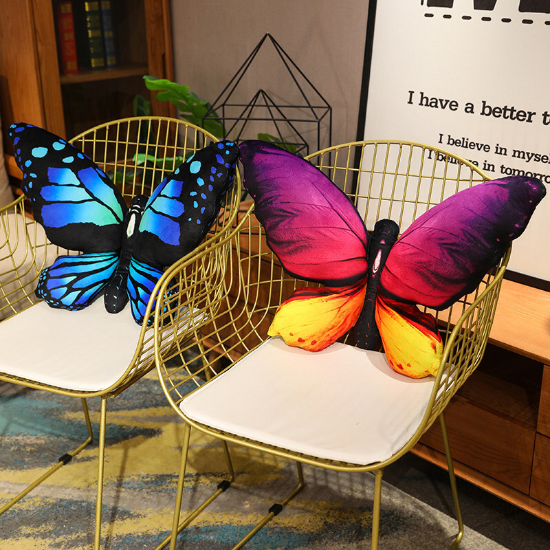 Soft butterfly plush pillows placed on chairs for comfortable seating and cozy home decoration