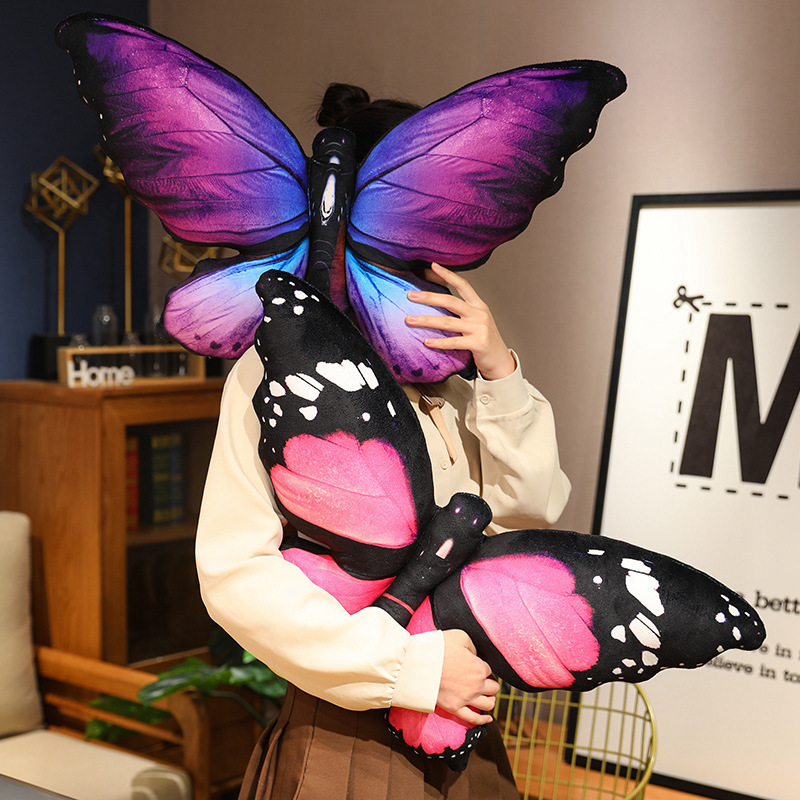 Purple and pink butterfly plush pillows displayed together as soft cushions for bedroom or sofa decoration