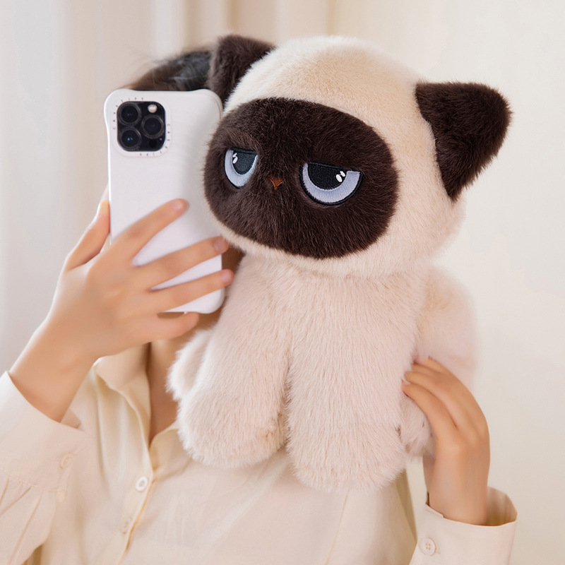 Soft sitting ragdoll cat plush toy being hugged indoors, showing its fluffy texture and cozy comfort for relaxation and home decor