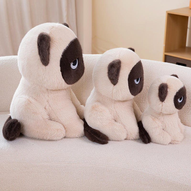 Side view of sitting ragdoll cat plush toys in multiple sizes on a sofa, highlighting cute design and cozy home decoration
