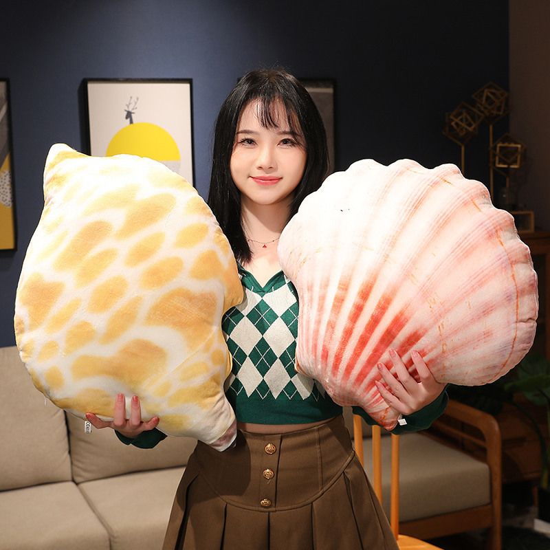 Realistic conch shell and scallop plush pillows with lifelike shell textures, soft ocean inspired cushions for cozy living room decor