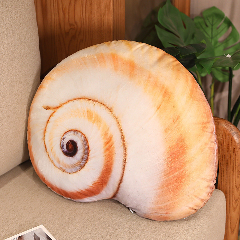 Realistic conch shell plush pillow placed on a sofa, ocean-inspired decorative cushion creating a calm and cozy coastal home atmosphere
