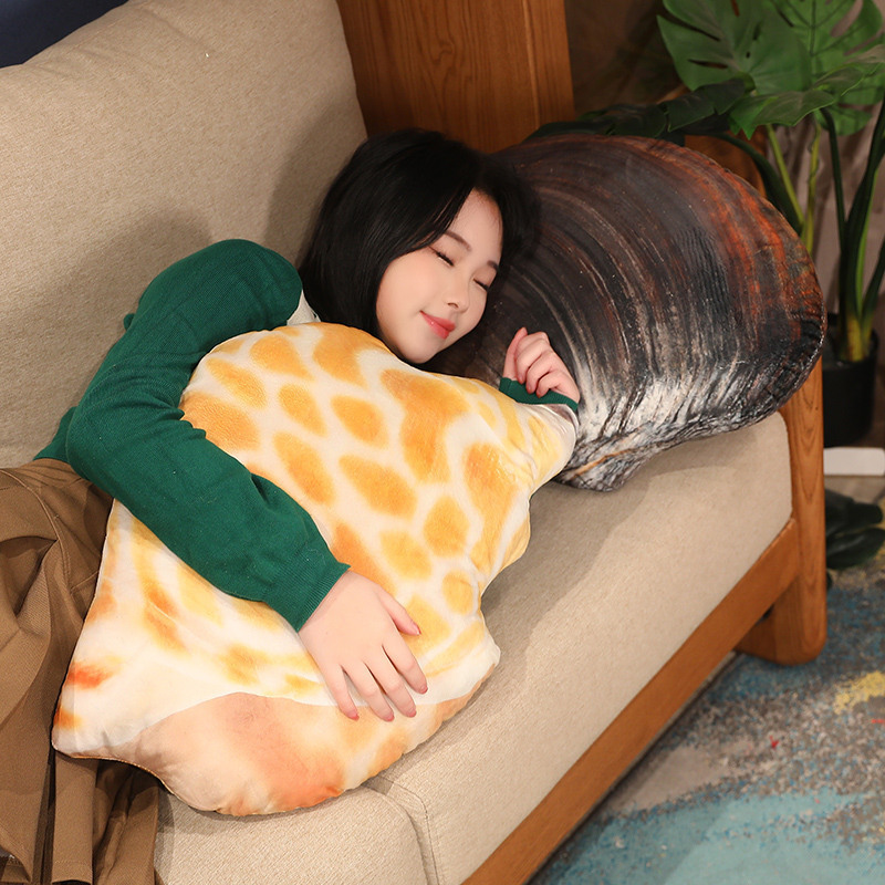 Realistic seashell plush pillow used as a cozy cushion for relaxing on the sofa