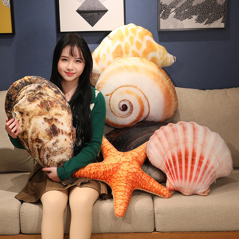 Realistic seashell plush pillow displayed on sofa, soft cushion with lifelike ocean shell texture for cozy home decor
