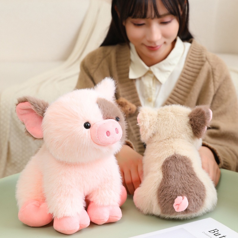 Cute mini pig plush toy shown from front and back, highlighting soft plush texture and rounded sitting design