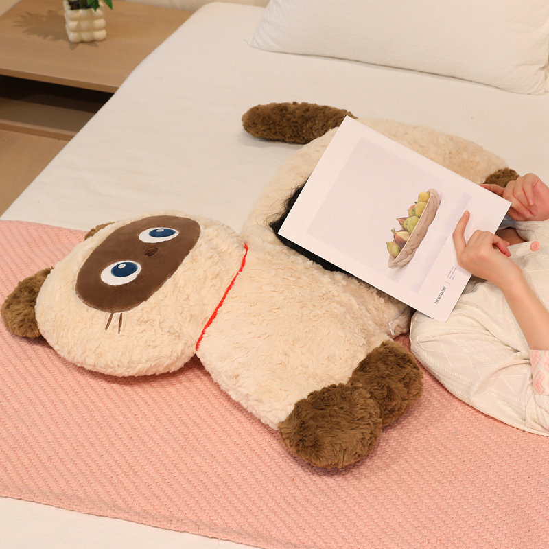 Soft fluffy animal plush pillow lying on a bed, used as a cozy body pillow for relaxing and reading, creating a calm and comfortable bedroom atmosphere