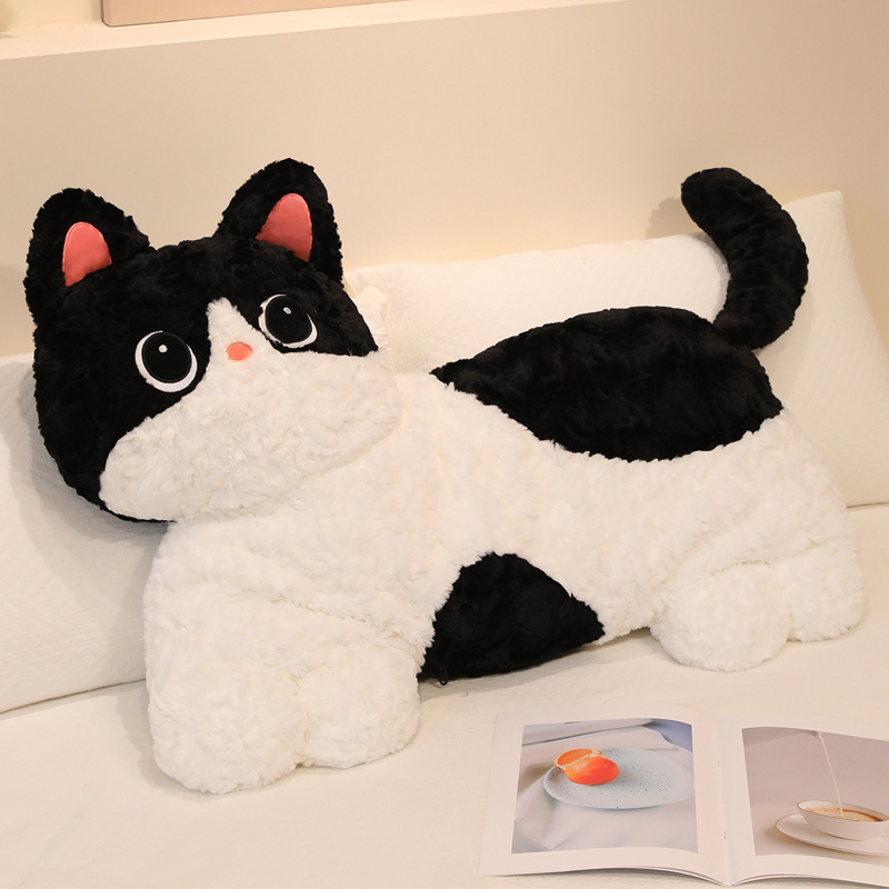 Cow cat plush pillow with fluffy texture placed on bed for hugging and everyday comfort