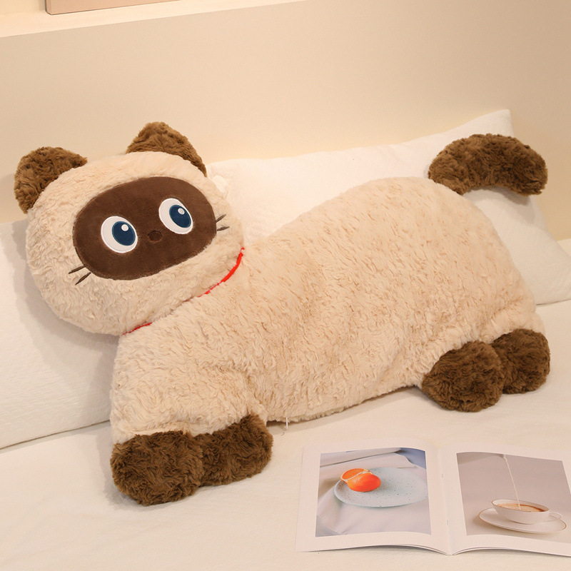 Siamese cat plush pillow with fluffy texture placed on bed for hugging and everyday comfort