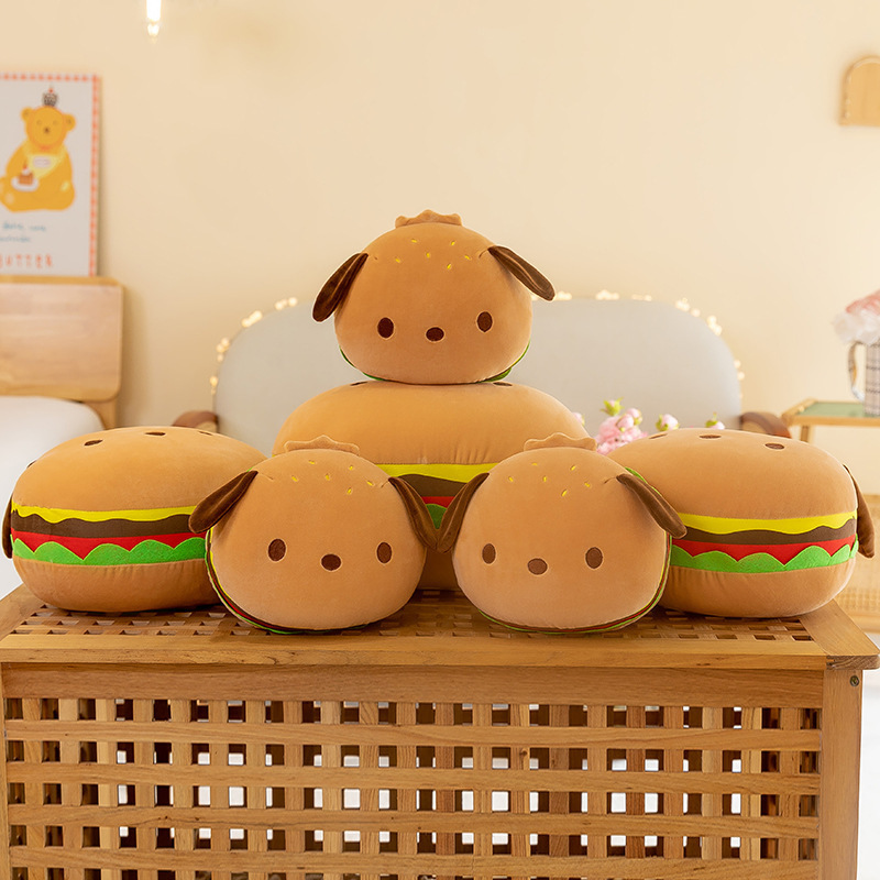 Burger dog plush pillow set displayed on a wooden table, showing multiple sizes with soft rounded shape, cozy home decor style