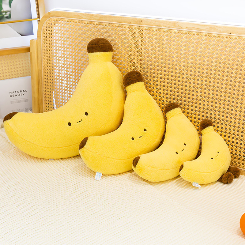 Banana plush toy with legs displayed in multiple sizes as cute decorative cushions for bed or sofa