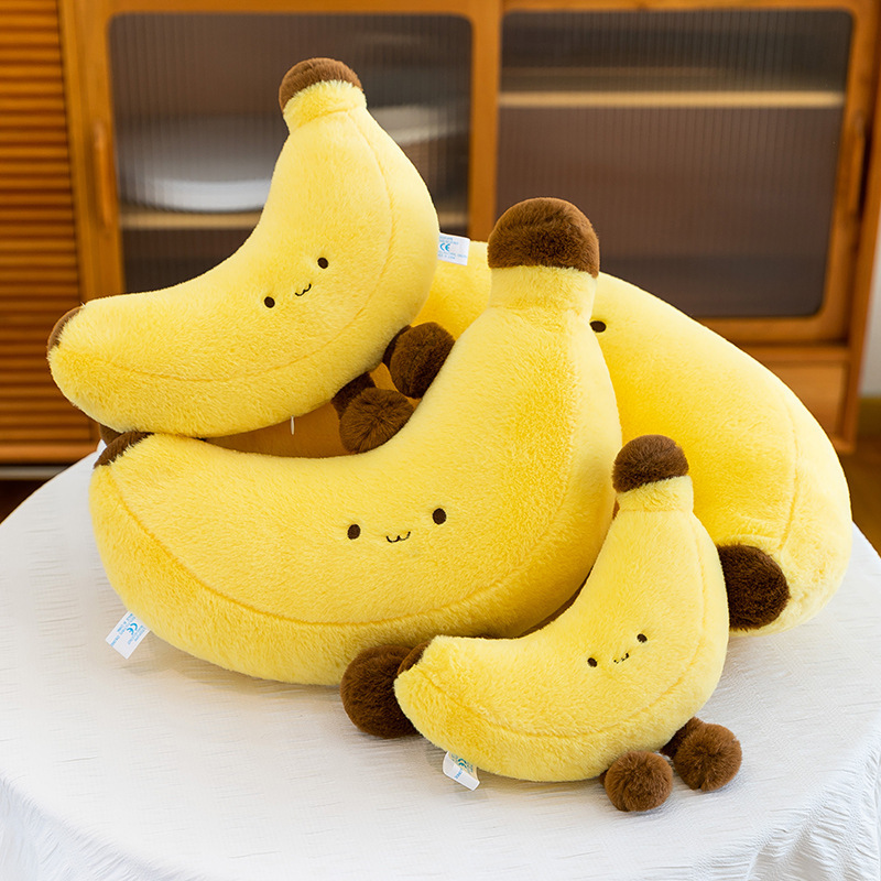 Banana plush toy with legs in different sizes displayed together