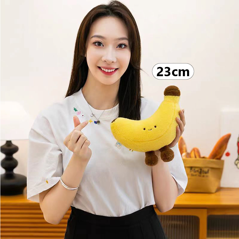 Banana plush toy with legs in 23 cm size, compact and cute soft plush ideal for desk decor, small gifts, or travel companionship