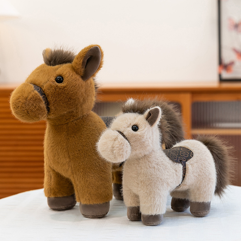 Realistic pony plush toy with saddle shown in two sizes, featuring soft plush fabric and fluffy mane, displayed in a warm living space, emphasizing size comparison and suitability for hugging, relaxation, and cozy home decoration
