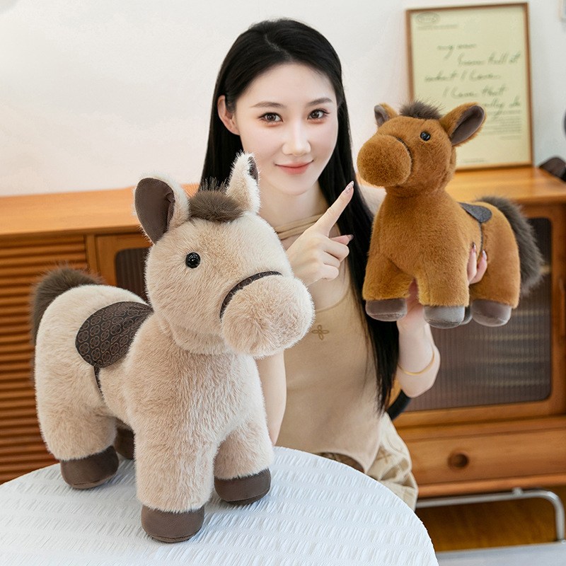 Realistic pony plush toy with saddle displayed in a cozy home setting, showing soft plush texture and lifelike horse design, ideal for hugging, decorating shelves, or adding warmth to living spaces