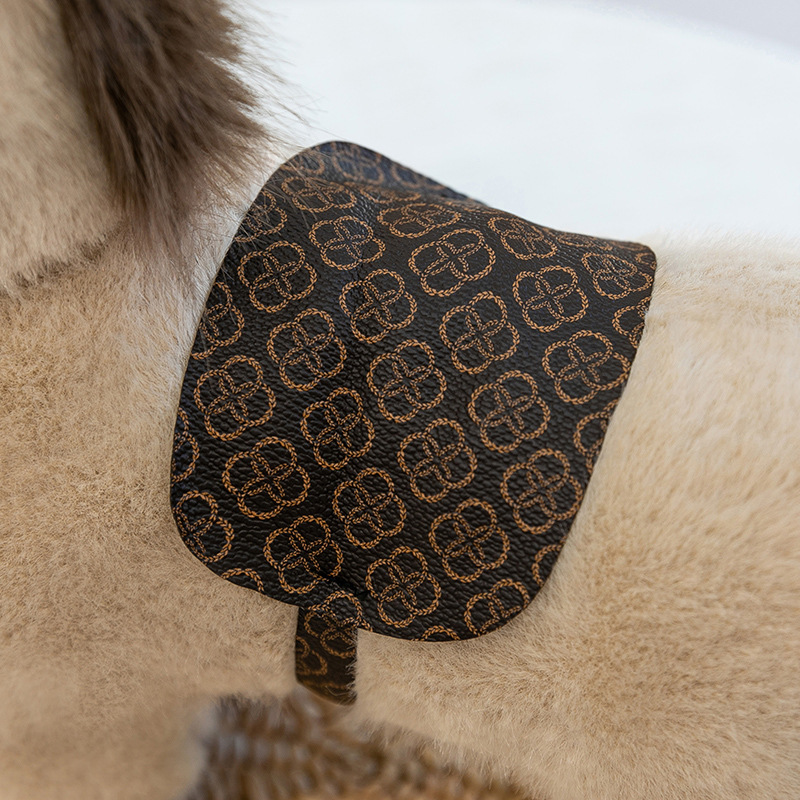 Detailed saddle design on realistic pony plush toy highlighting patterned fabric and craftsmanship for decorative display