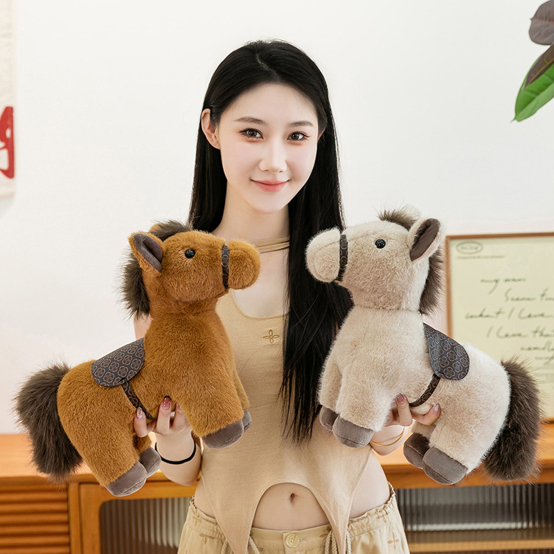 Realistic pony plush toys in khaki and brown displayed side by side, featuring soft plush fabric, detailed saddle design, fluffy mane and tail, suitable for hugging, shelf decor, and cozy gift giving