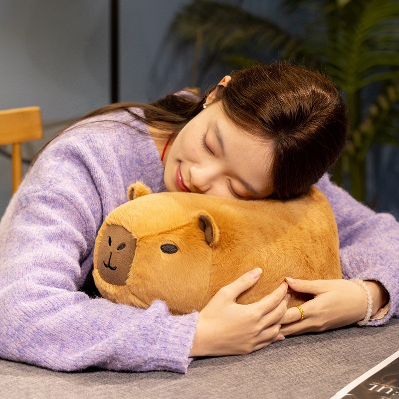 Capybara plush toy used as a cuddly comfort plush, soft and squishy design for hugging and resting, creating a warm and relaxing home atmosphere