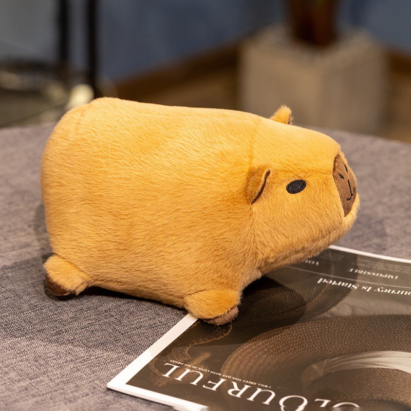 Capybara plush toy side view showing soft plush fabric and compact shape for cozy home decor