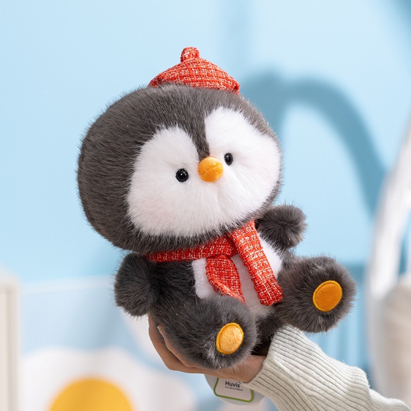 Coco penguin plush toy with red scarf, soft and fluffy texture, lightweight size for easy holding, perfect for cozy decoration, gentle and cheerful atmosphere