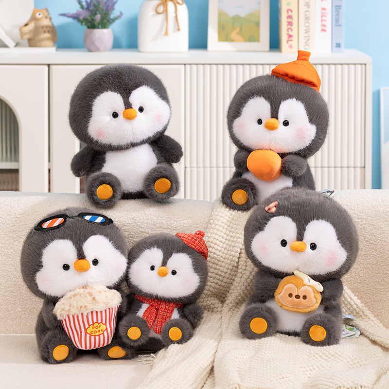 Coco penguin plush toy collection with multiple cute styles displayed together