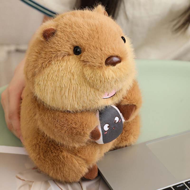 Cute marmot plush toy with round fluffy shape, soft plush texture, displayed beside a desk for cozy and relaxing home decor