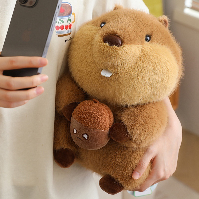 Cute marmot plush toy held for casual moments, fluffy stuffed animal with nut design, perfect for comfort, decoration, and adding warmth to daily life