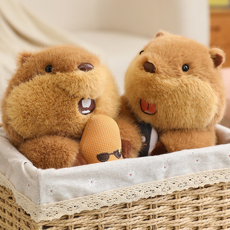 Cute marmot plush toys holding peanut and sunflower seed, soft plush texture, displayed in a woven basket for cozy home decor and gift inspiration