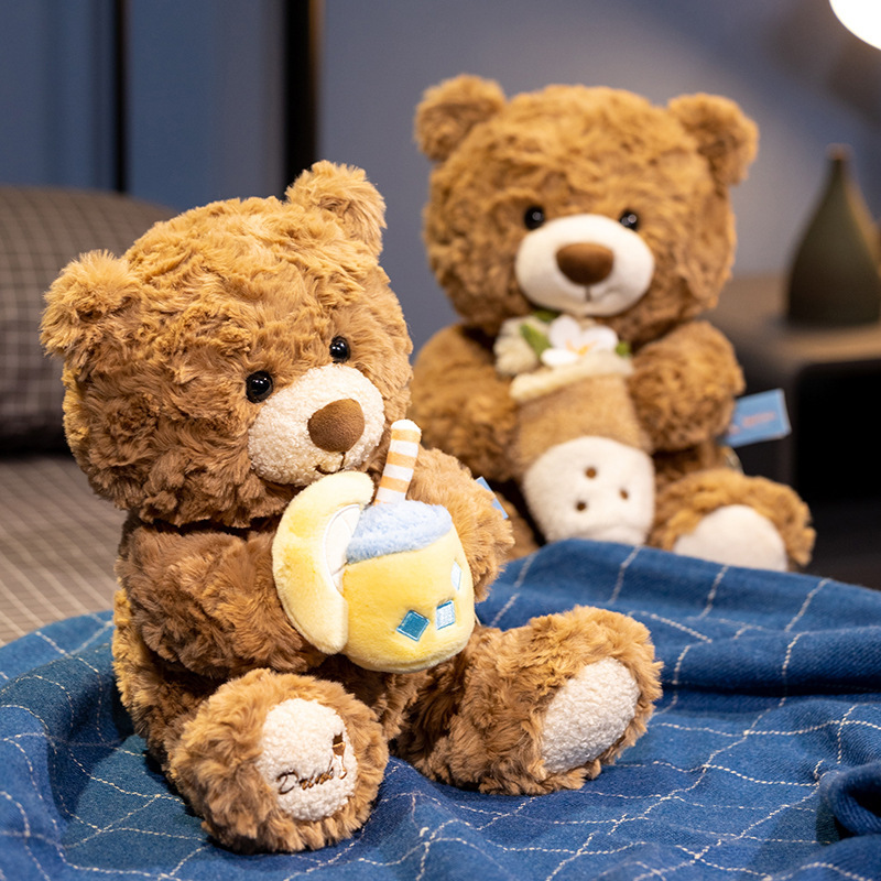 Lemon milk tea bear plush toy sitting on bed with soft blanket