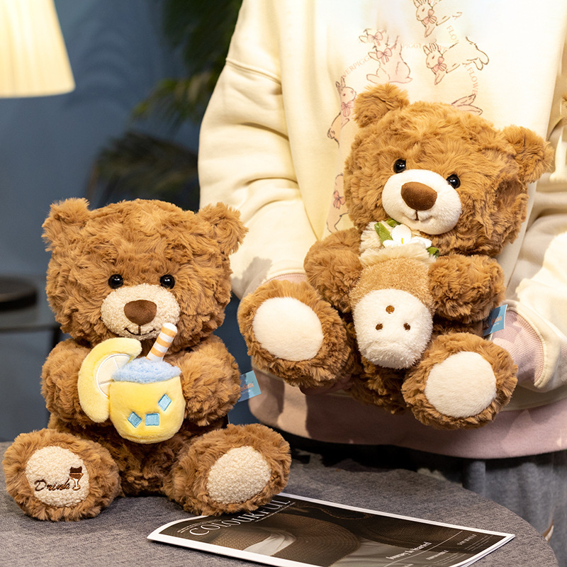 Milk tea bear plush toys in pearl and lemon designs displayed in a warm indoor setting, ideal for hugging or home decor