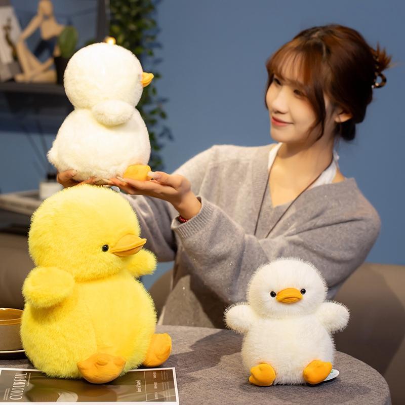 Soft duck plush toy displayed in a cozy indoor setting highlighting fluffy texture and decorative appeal