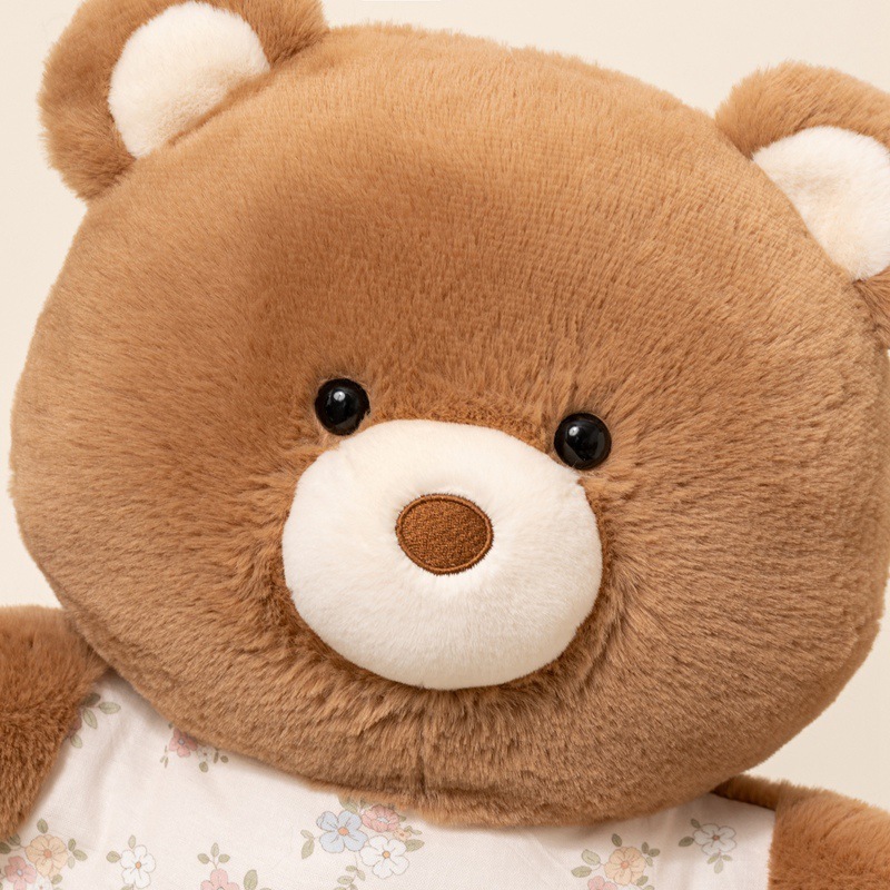 Brown bear pajama animal plush pillow close up showing soft plush fabric, rounded face and cozy design for hugging and home comfort