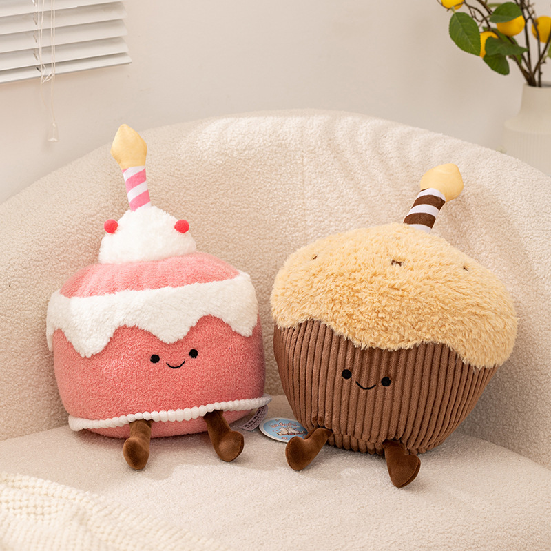 Dessert cake plush toys in pink memory and muffin designs displayed on a cozy sofa, soft stuffed plush for home decor and hugging